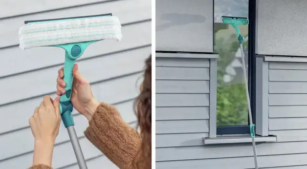 En person använder en fönsterputs med teleskopskaft för att rengöra ett fönster. Detta är den bästa fönsterputs för att få skinande rena fönster.